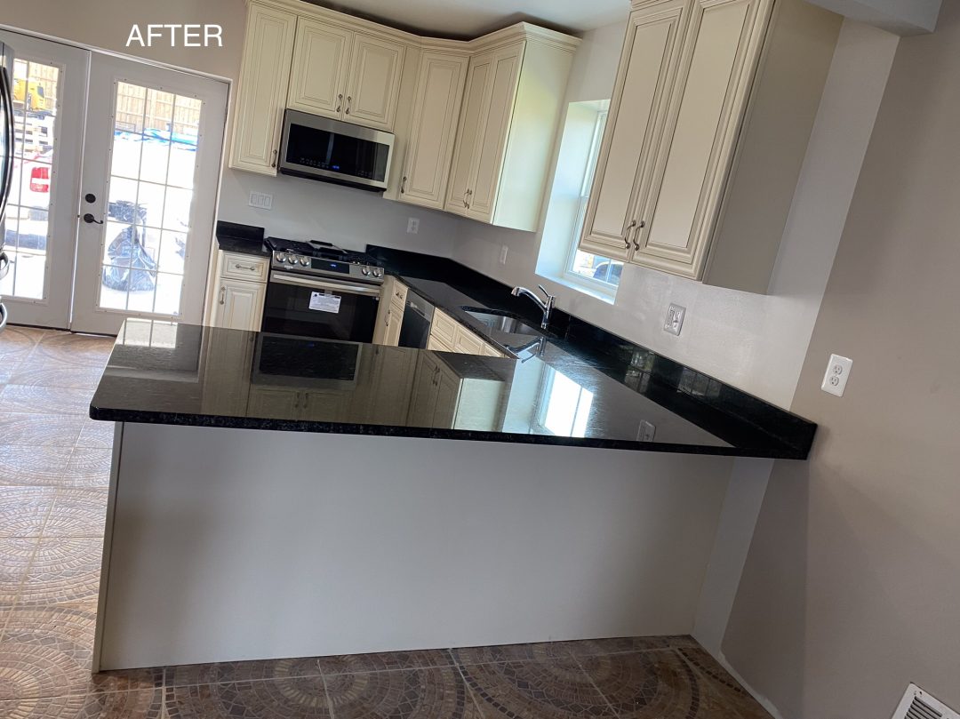 Modern kitchen with cream cabinets, black granite countertops, and stainless steel appliances. "AFTER" text in corner.